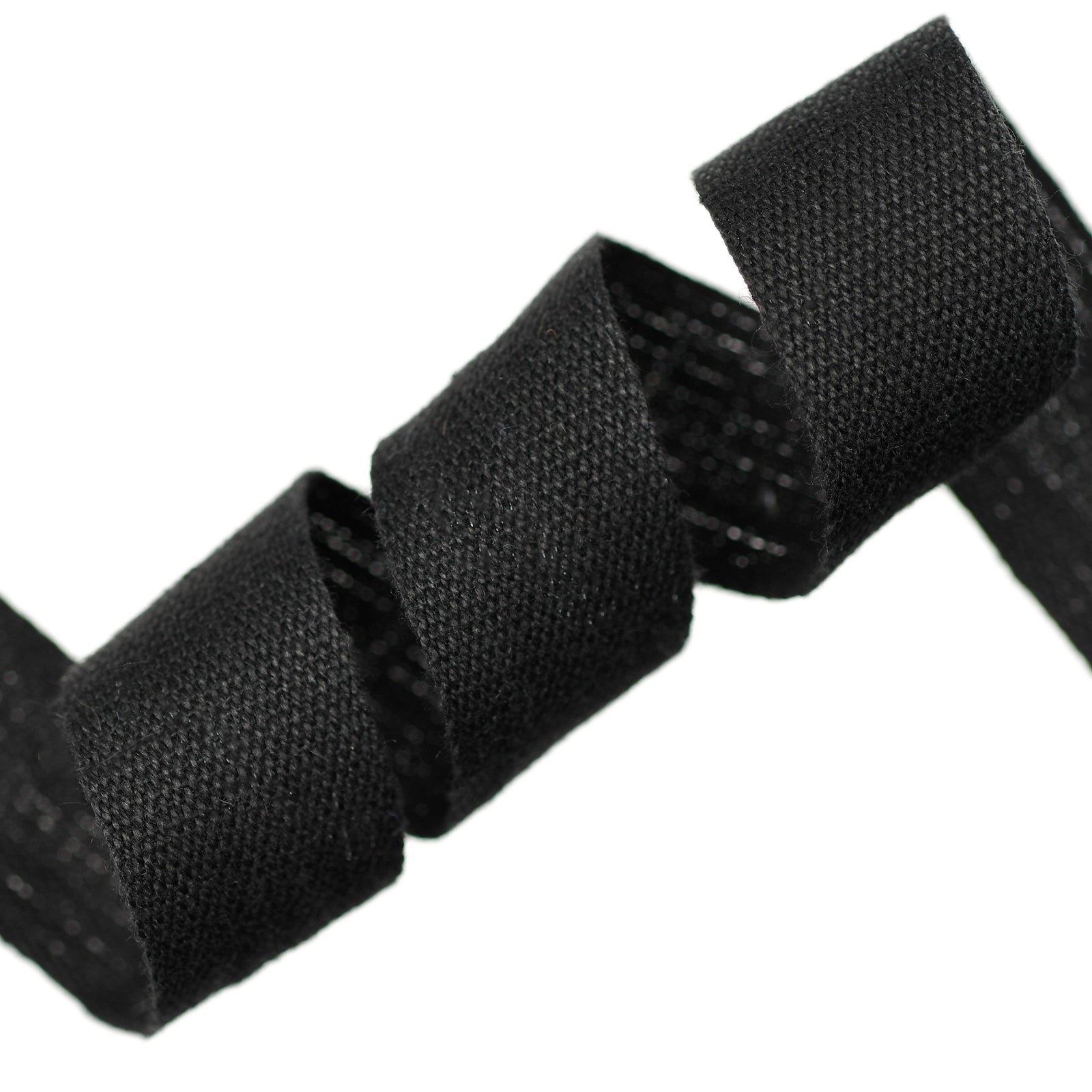 Close-up of black woven cotton tape on a white background