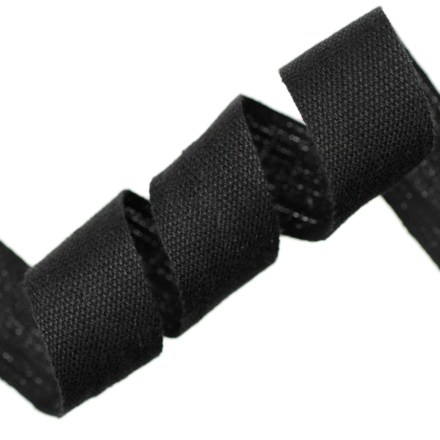 Close-up of black woven cotton tape on a white background
