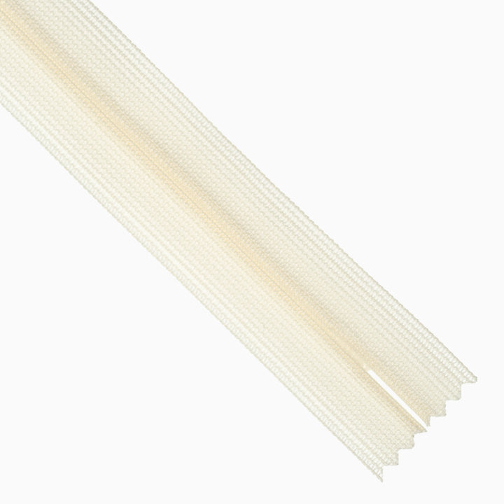 Ivory invisible zipper on white background.