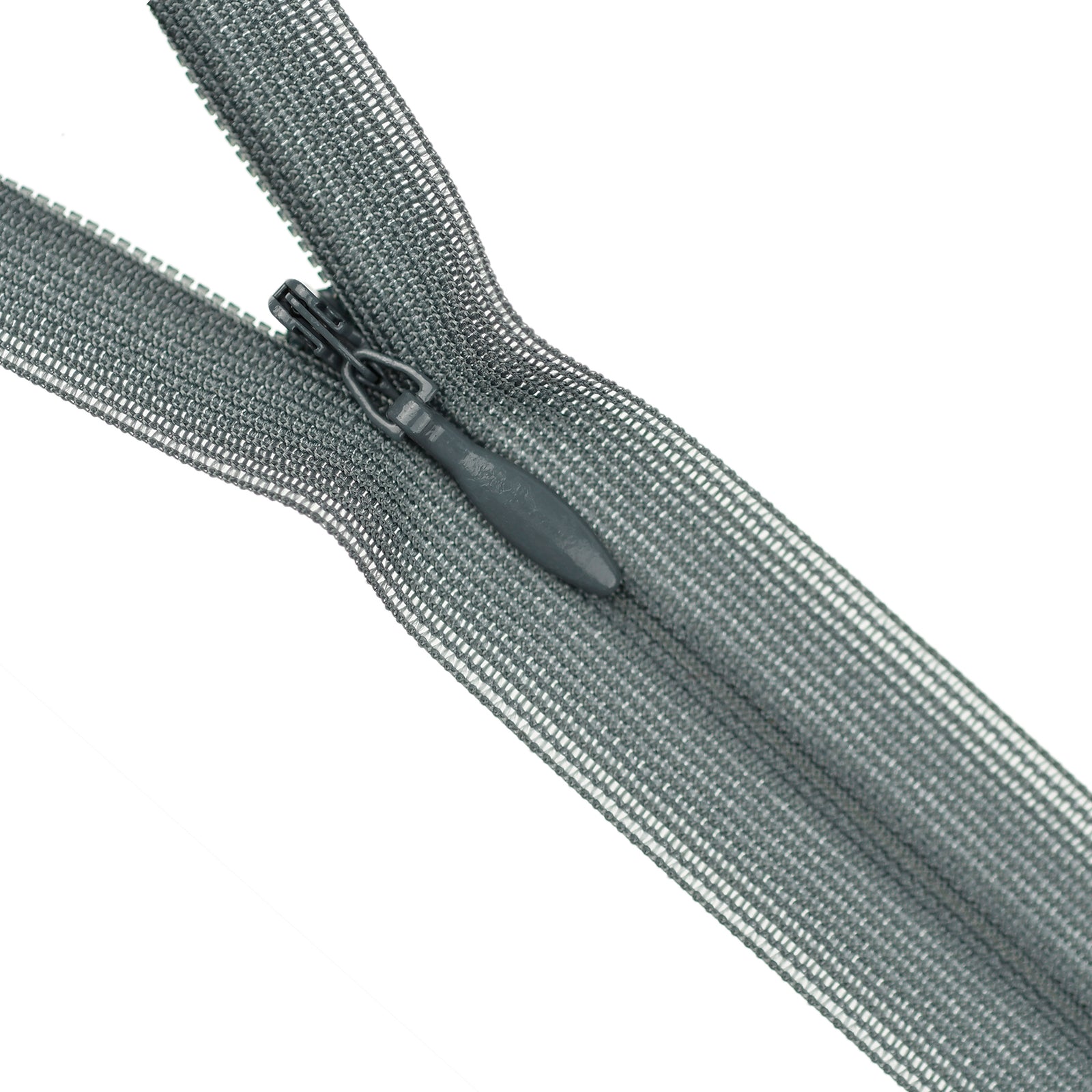 Close-up of a grey invisible zipper on a white background