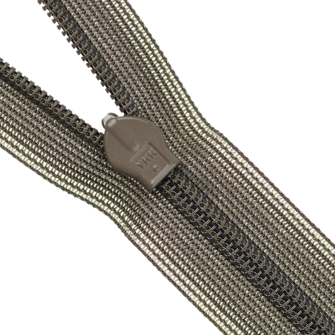 Close-up of a brown invisible zipper on a white background