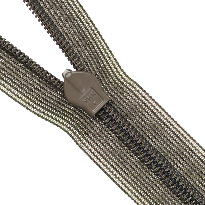 Close-up of a brown invisible zipper on a white background