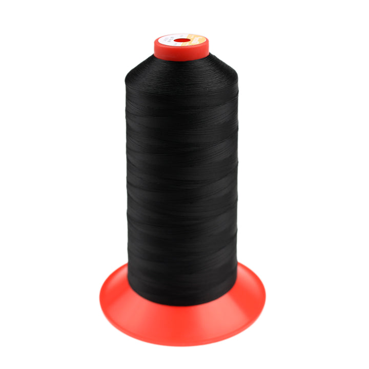 Spool of black thread for leather against a white background