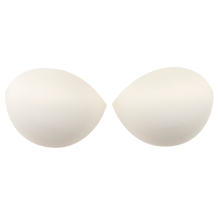 pair of push-up ivory or off-white bra cups on white background