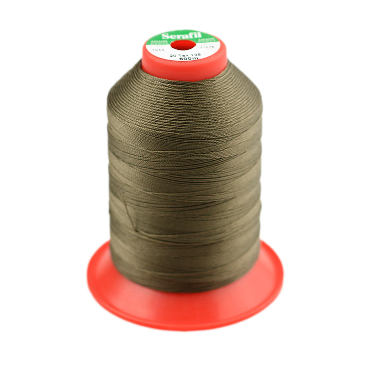 Spool of khaki green thread on a white background