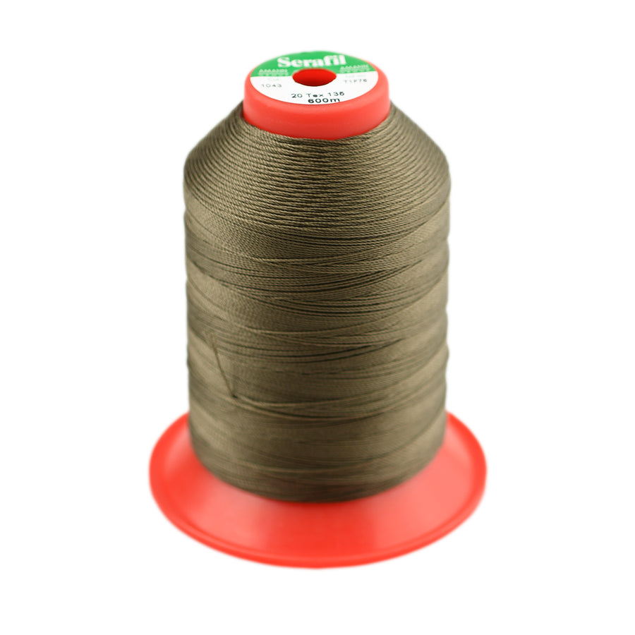Spool of khaki green thread on a white background