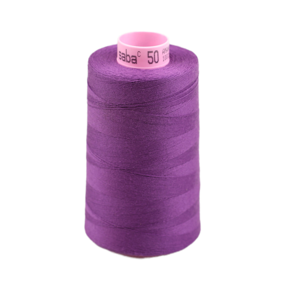 Spool of purple thread with a visible brand label on a white background