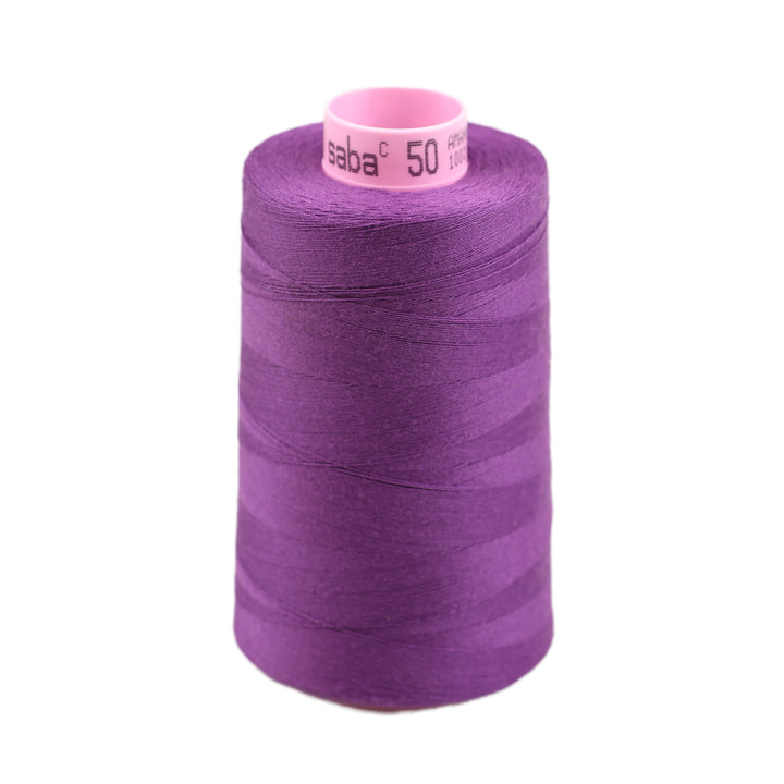 Spool of purple thread with a visible brand label on a white background