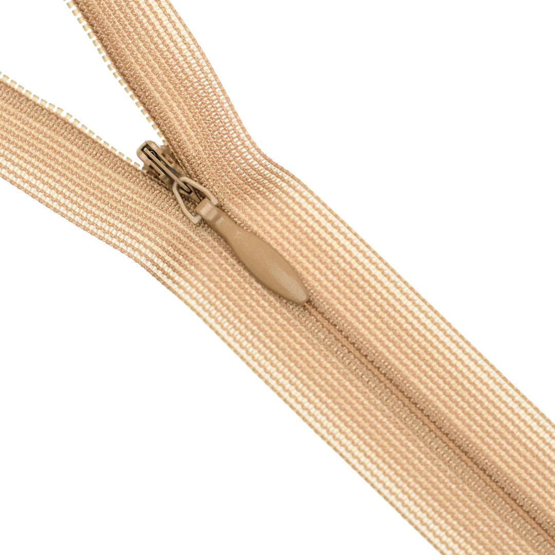 Beige invisible zipper on a white background
