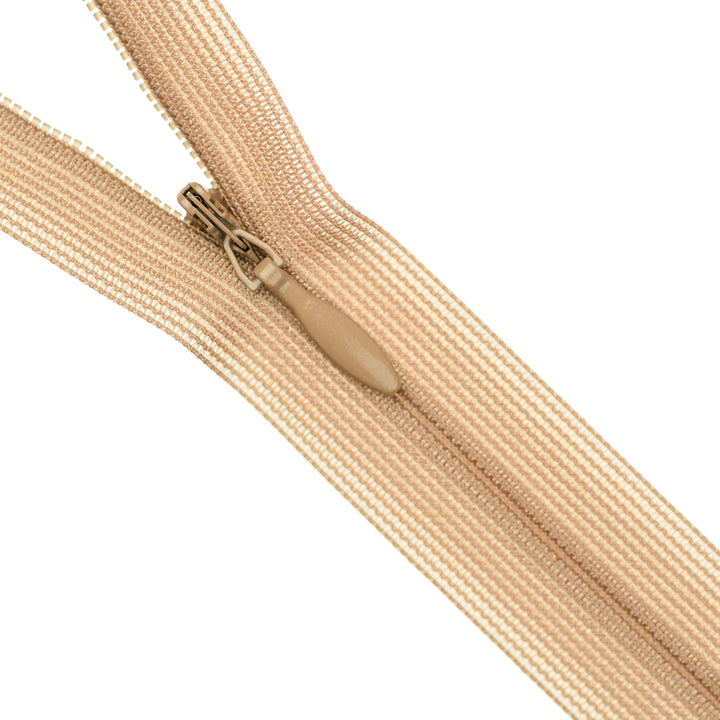 Beige invisible zipper on a white background