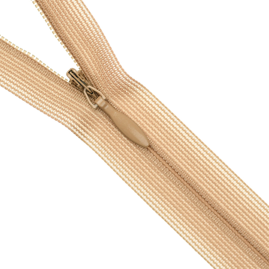 Beige invisible zipper on a white background
