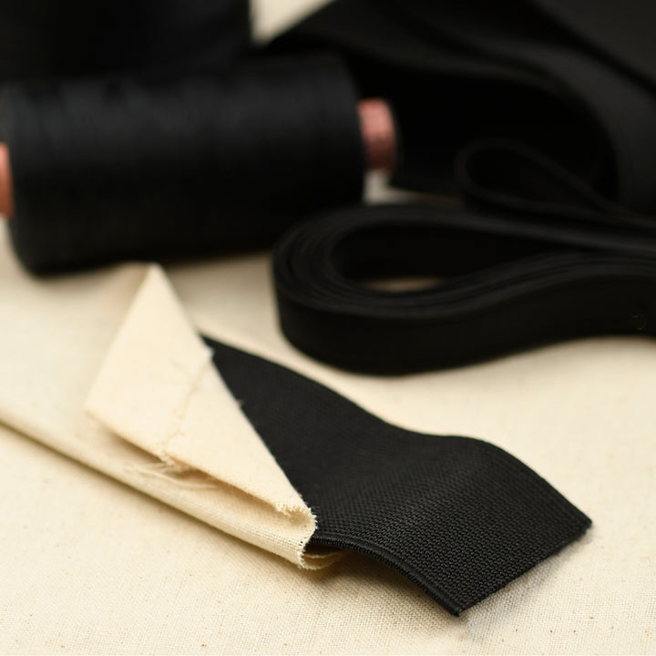 close up of black elastic and sewing materials