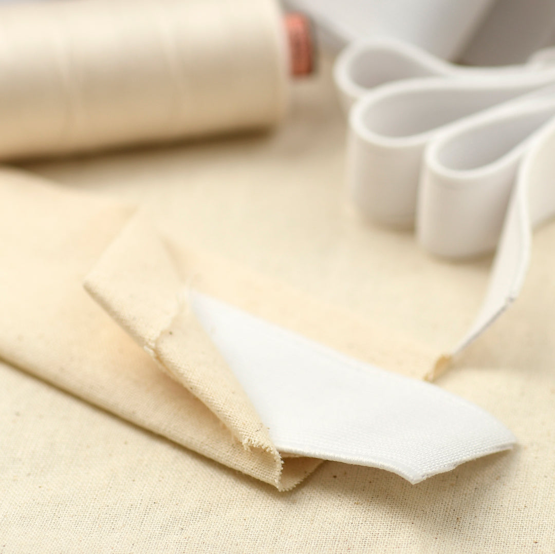 close up of white elastic and sewing materials