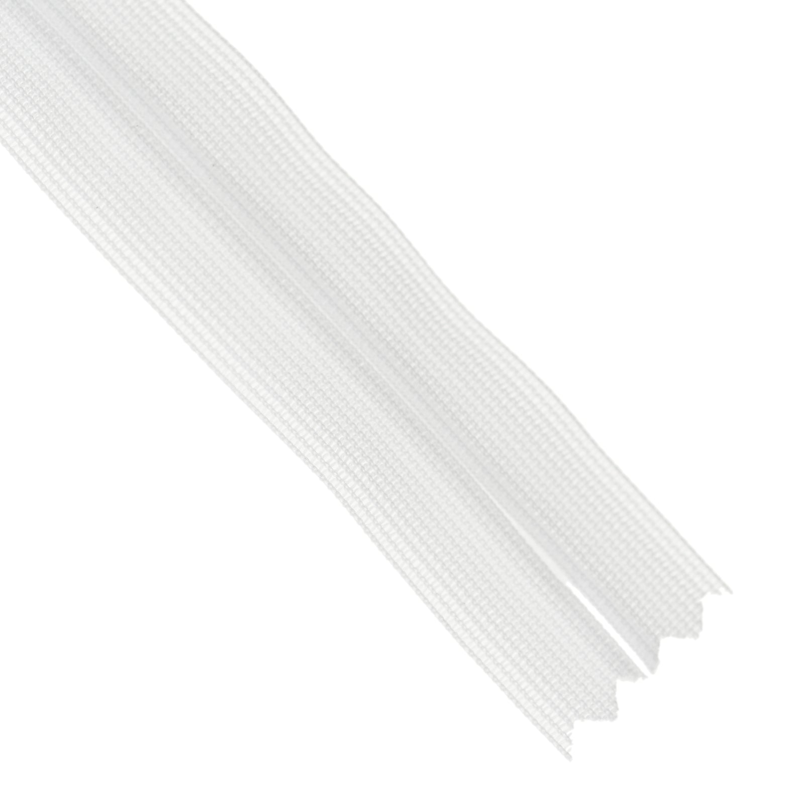 Close-up of the end of a white invisible zipper on a white background.